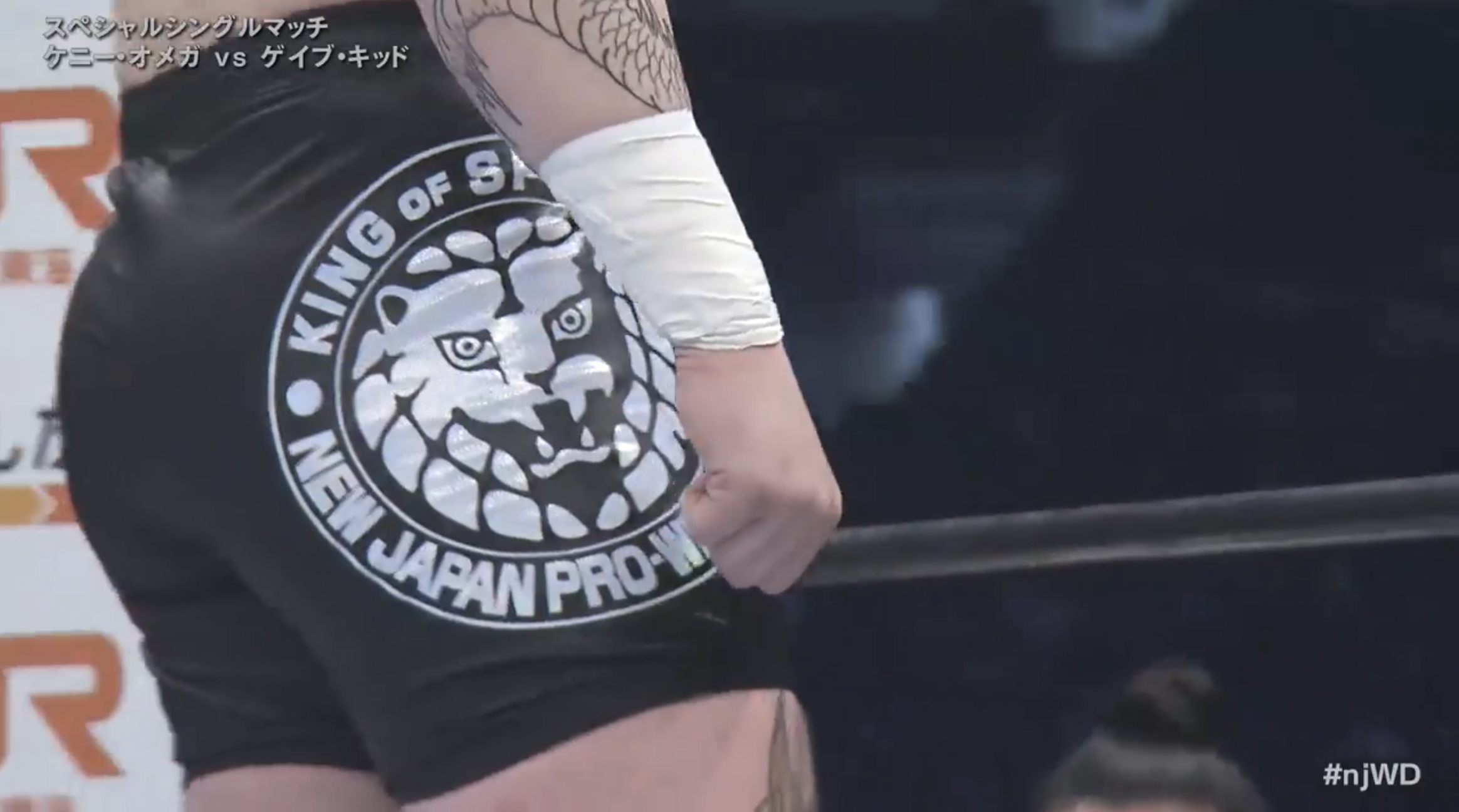 Gabe Kidd's trunks, displaying a white New Japan Lion Mark on a black background