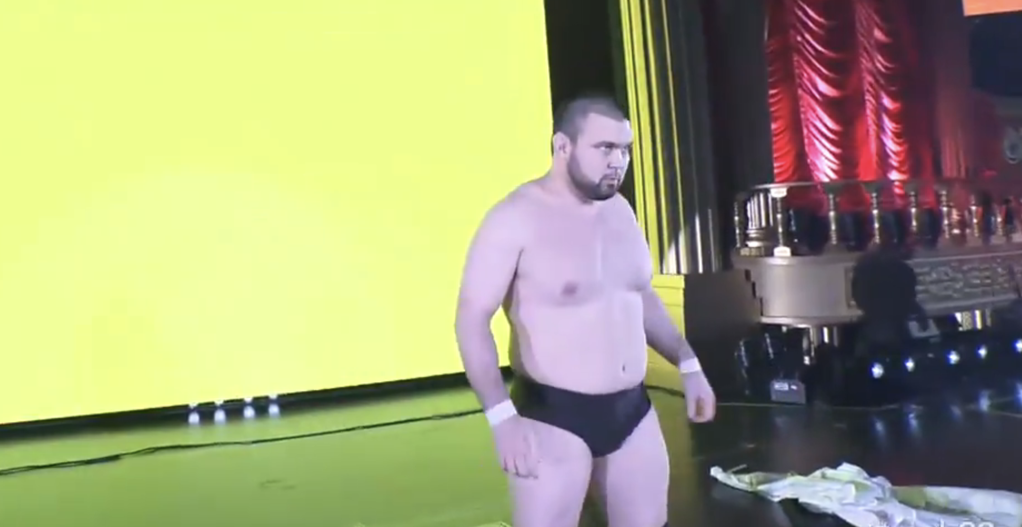 Aaron Wolf in plain black Young Lion trunks